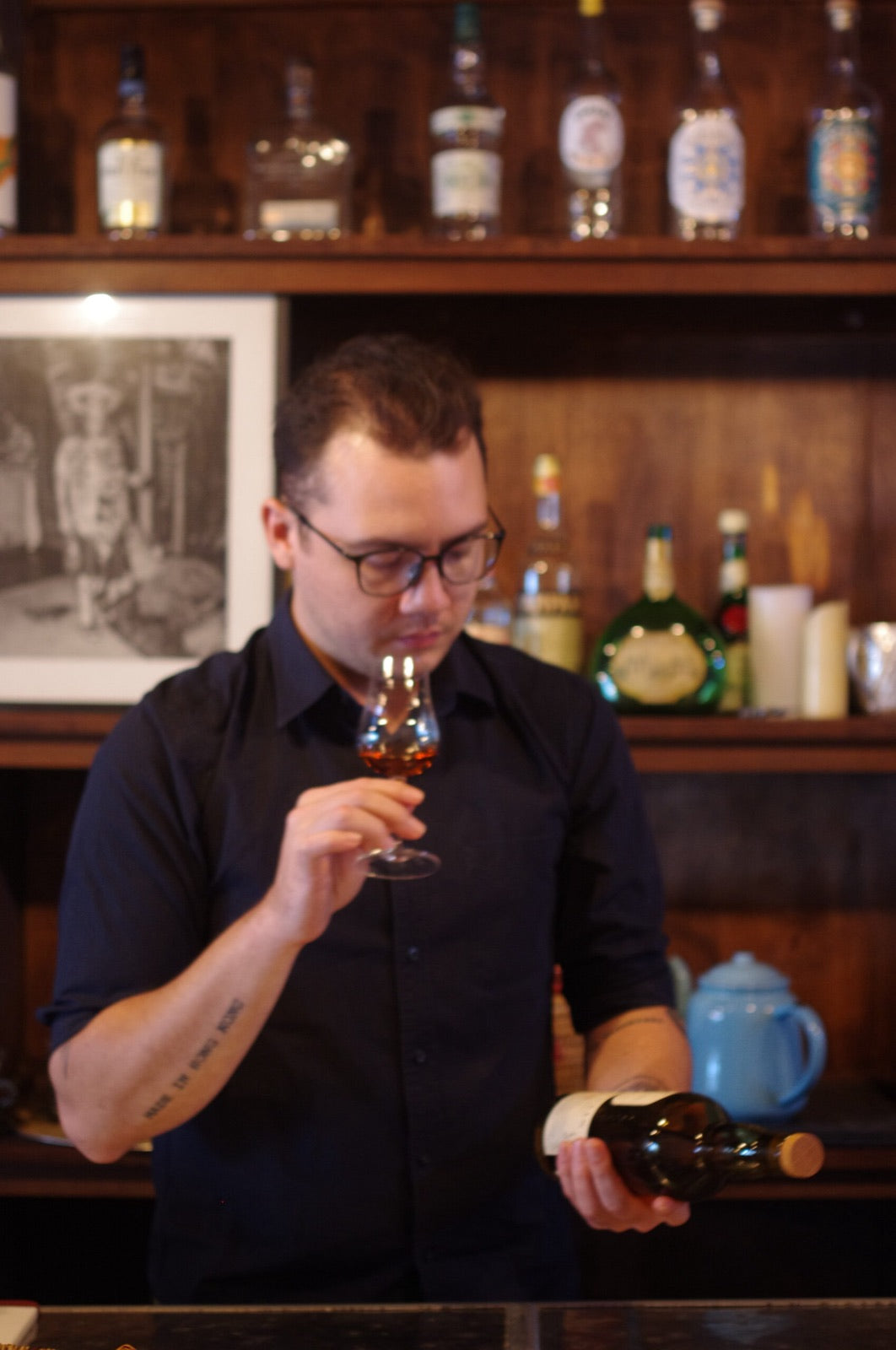 A trade professional nosing a spirit in the Tincture House Spirits Library